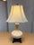 Design Plus Gallery presents an Aladdin Style Table Lamp. The lamp is an off white tone of porcelain in the shape of a...