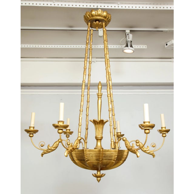 Bespoke Giltwood hand-carved six-arm chandelier in the neoclassic manner.