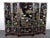 Vintage Chinese five-panel folding screen in black lacquer, richly decorated with carved hardstone relief depicting cranes...