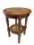 A beautifully crafted two-tier round accent table featuring handwoven cane insets, made in Indonesia in the late 20th...