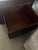 Elegant Ralph Lauren coffee table is constructed with woven rattan panels and a dark wood frame. This trunk-style piece...