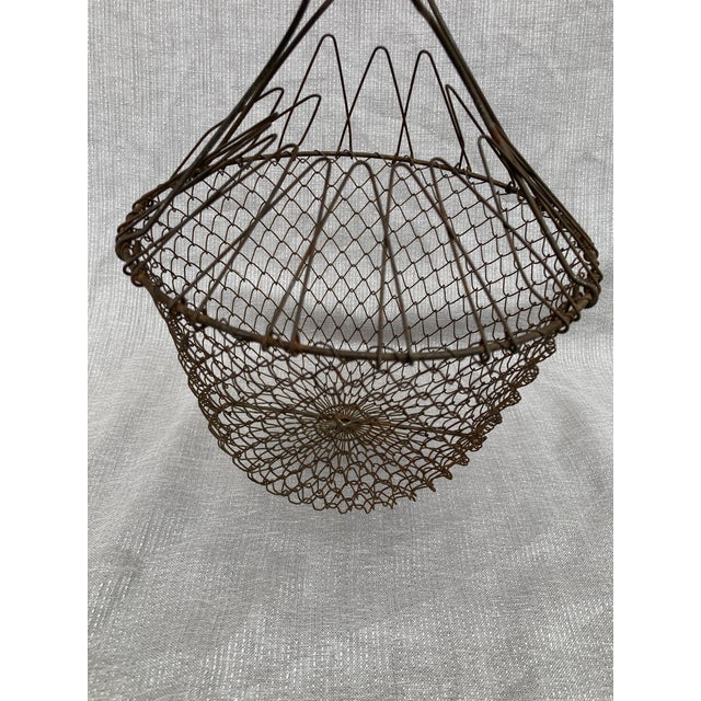 Charming vintage French wire collapsible egg basket that stands freely, will collapse flat or that can be carried with...