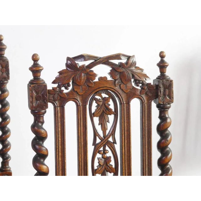 Beautiful antique wooden renaissance chairs with a fabric blue seat. The chairs have barley twist columns and legs and...