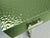 Italian three-drawer console table with textured green Murano glass across the top and drawer fronts. Each drawer has a...