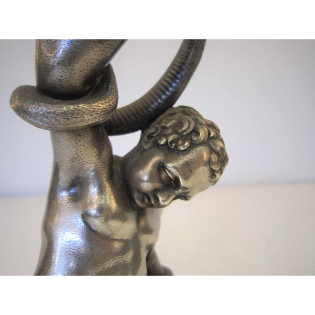 A fine quality mid-19th century silver electroplate sculpture of a nude male figure after the antique, on original...