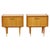 A lovely pair of vintage design nightstands, crafted from light-colored wood veneer and pine, featuring metal handles and...