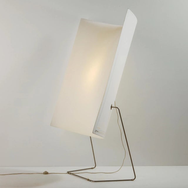 The ‘Model 44F’ floor lamp designed by Bakery Group for Prandina in the 2000s. The lamp has a huge stretched textile...