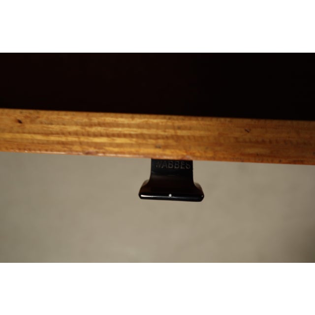 Elegant writing desk designed by Jules Wabbes and produced by Mobilier Universel, Belgium, circa 1960. The desk features a...