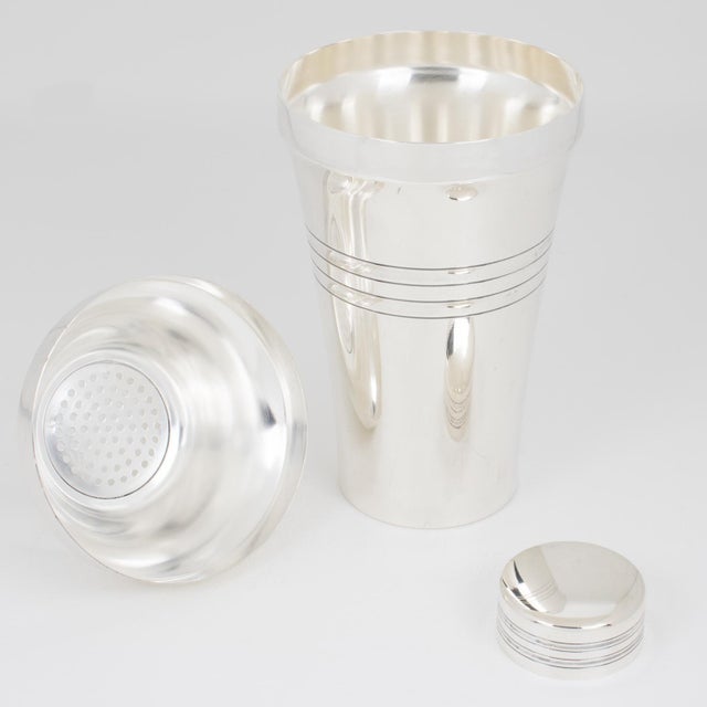 This refined three-sectioned cocktail shaker was crafted by the renowned silversmith Saint Medard in Paris for the Le...