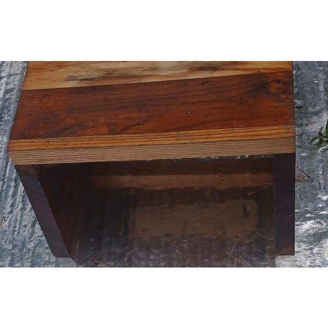 Sturdy rustic wood stool features contrasting wood tones and is versatile enough to serve as a small bench, foot stool,...