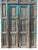 A late 19th century pair of Mexican Spanish double doors — a set of doors within the doors, Santa Fe style. Measures 59"W...