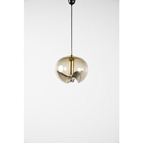 Putzler futura large model pendant with the distinctive ‘wave’ in the glass. This piece has a brass base with a smoked...