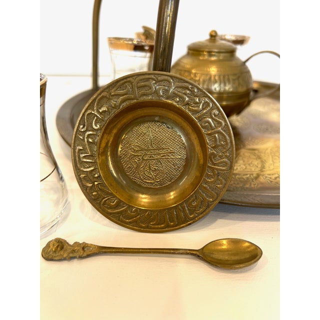Stunning vintage brass and glass 1960s Turkish Tea Set featuring 6 glass teacups with 22k gold-plated accents, 6 handmade...