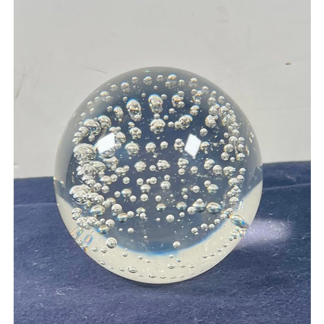 This striking mid-century modern style hand-blown clear art glass paperweight features an intricate, symmetrical pattern...
