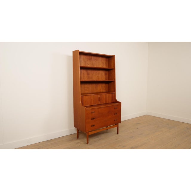 Beautiful vintage bookcase from the 1960s, from Denmark, designed by Johannes Sorth. The vintage cabinet has 3 shelves at...