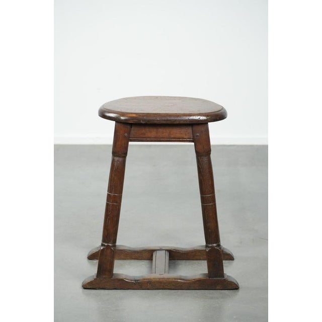 We are offering this unique antique Dutch oak stool from the early 19th century, featuring a charming design. This...