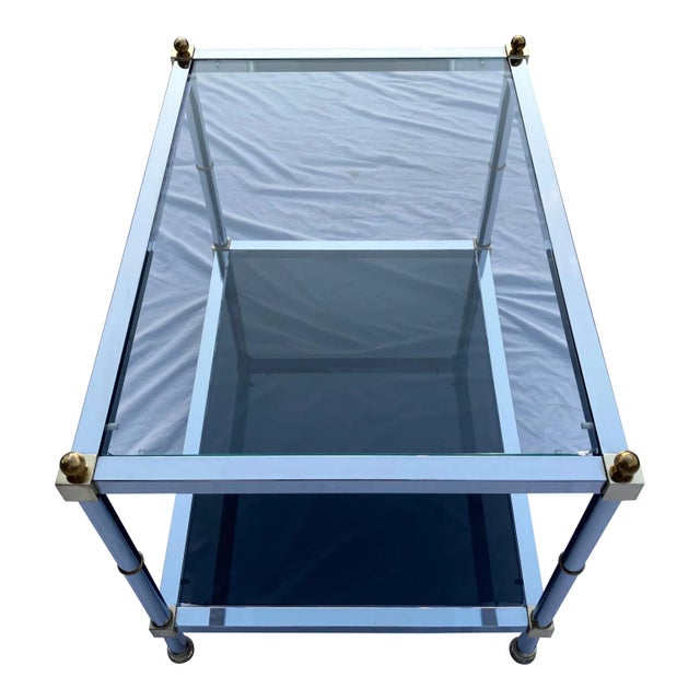 Iconic chrome brass and tiered glass small coffee or end table, from Maison Jansen, circa 1970s.