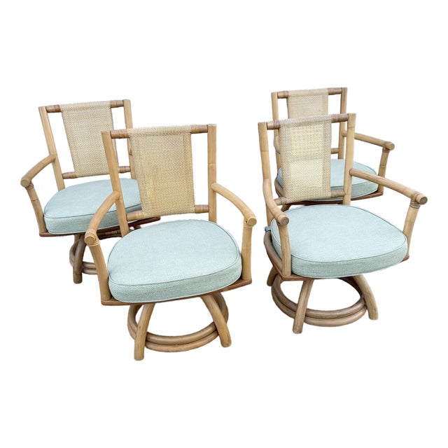 Boho Chic Rattan Cane Back Swivel Dining Arm Chairs - Set of 4 For Sale