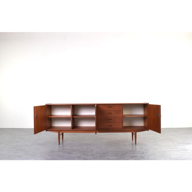 This Danish teak sideboard from the 1960s is an example of design that combines functionality with a minimalist form. The...