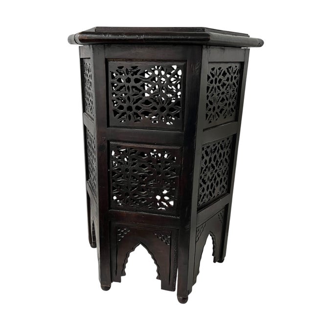 Vintage Anglo-Indian side drink table. Carved floral pattern beneath a hexagon top with gallery. Measures at the widest...