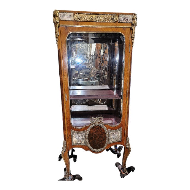 What an elegant 20th c. curio cabinet or 'virtrine' in the Louis XV style from Italy, inlaid marble panels trimmed...