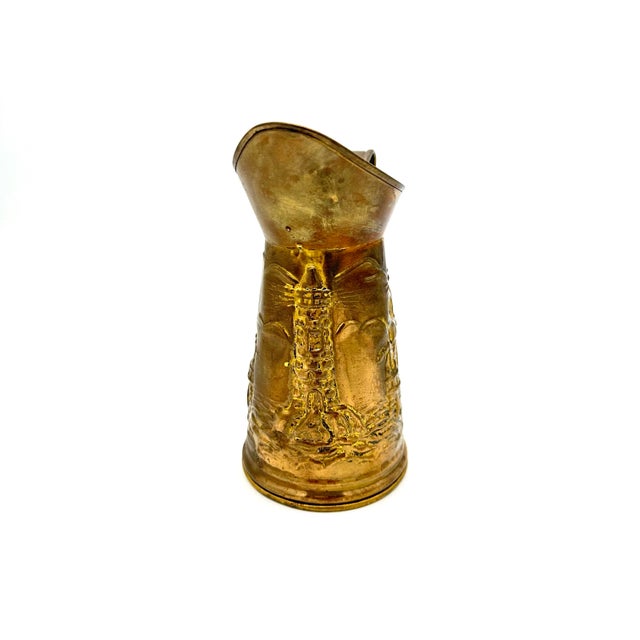 Add a touch of vintage charm to your collection with this beautiful Peerage Embossed Brass Pitcher. The pitcher features a...