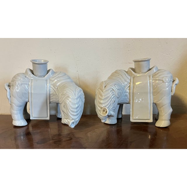 Antique 18th century Chinese blanc de Chine porcelain elephant form candle holders. These were originally used to burn...