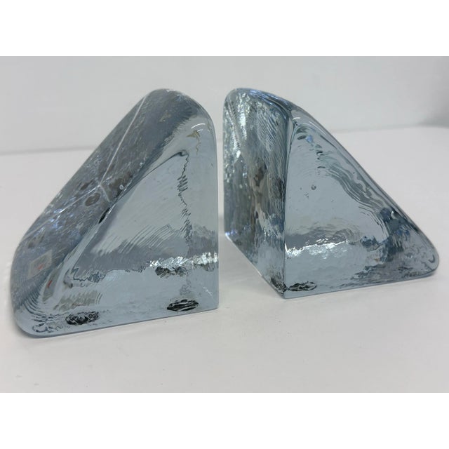 Pair of handmade glass bookends with smooth top and textured sides by Blenko Glass, USA circa 1980s. Measurement for each...