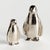 Hand crafted using a centuriesold sand cast method, this set of 2 adorable upright penguin sculptures is a charming little...