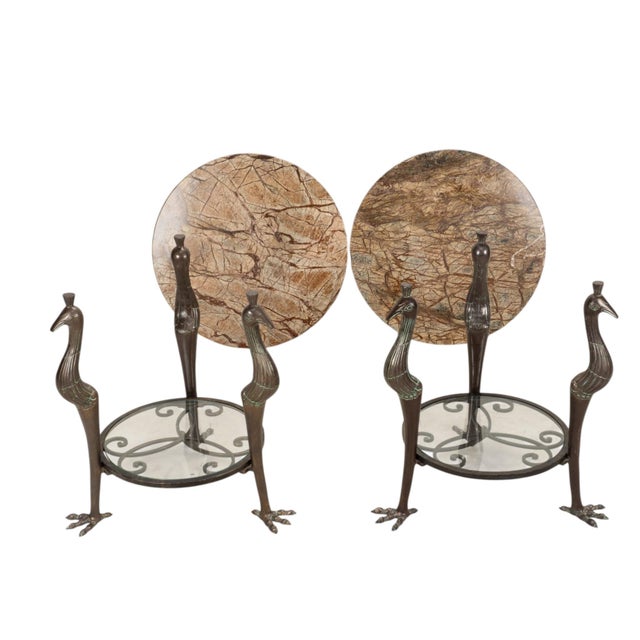 A pair of vintage side tables attributed to Maitland-Smith, featuring heavy bronze bases with three sculptural birds...