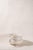American spongeware mixing bowl with a single handle, cream ground, and pale blue hand-sponged decoration. Thick stoneware...