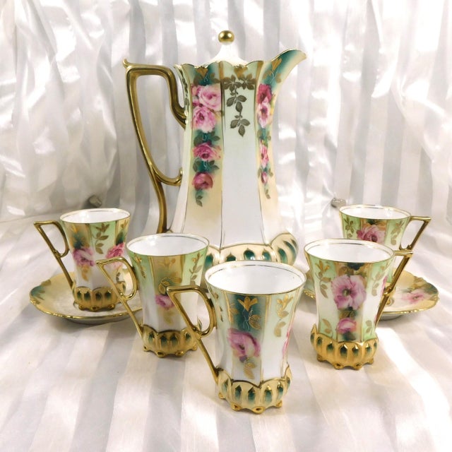 This is a nine piece Reinhold Schlegelmilch Chocolate Pot Set that includes the pot, matching lid plus five cups and two...