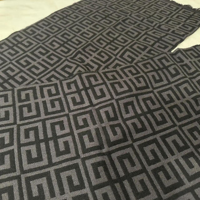 This scarf embodies a classic, understated elegance typical of the 1990s. It's a piece that speaks of quiet sophistication...