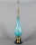 A Mid Century Murano art glass table lamp by Barovier & Toso. Hand blown aqua blue glass with colorful murrines and silver...