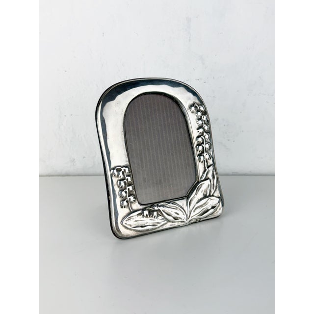 Beautiful vintage Italian photo frame featuring a hallmarked silver front with an elegant lily of the valley floral motif...