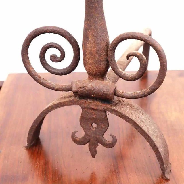 Item : this charming pair of wrought iron andirons exemplifies the traditional craftsmanship typical of historic...