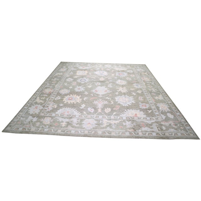 Hand-knotted with care using traditional rug making techniques, this wool rug blends timeless craftsmanship with a modern...