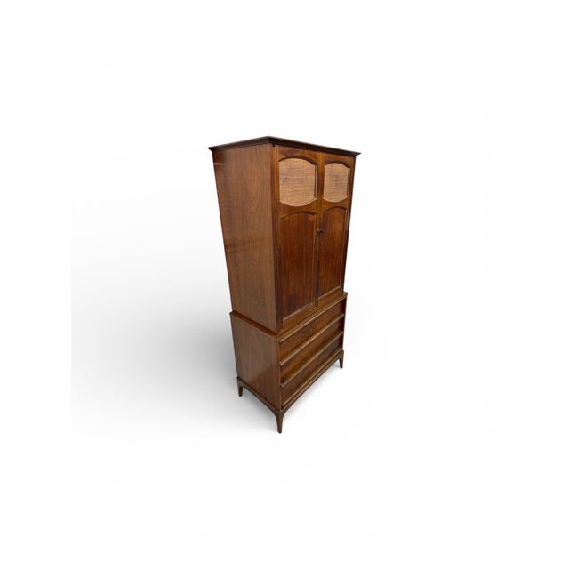This rare Mid-Century Modern Lane Rhythm walnut armoire is a stunning and highly sought-after storage piece. Beautifully...