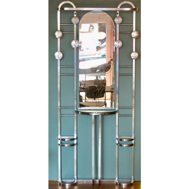 This coat stand was made and manufactured in France in the 1930s. It is made from polished aluminium with eight hooks, a...
