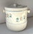 This charming ceramic biscuit jar features dimensional ribbing around its lower half , blue pin stripping, round ceramic...