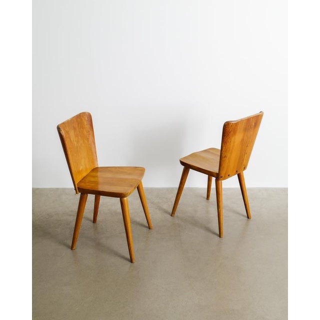 A rare and iconic set of four early swedish mid century wooden dining chairs model "510" in stained pine designed by göran...