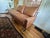 This Elegant Vintage Modern Loveseat has been completely restored and professionally reupholstered in light brown leather...