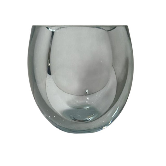 A striking mid century Swedish glass vase, circa 1950s. Expertly crafted with glass over an inch thick, this piece is as...