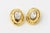 Kalinger Paris hammered goldtone earrings with large oval Swarovski crystal centers, circa 1985. Signed Kalinger Paris....