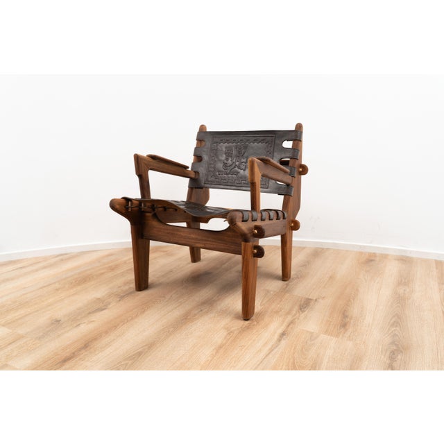 Lounge chair by Angel Pazmino for Muebles de Estilo. The chair is made out of wood and features interlocking joints, held...