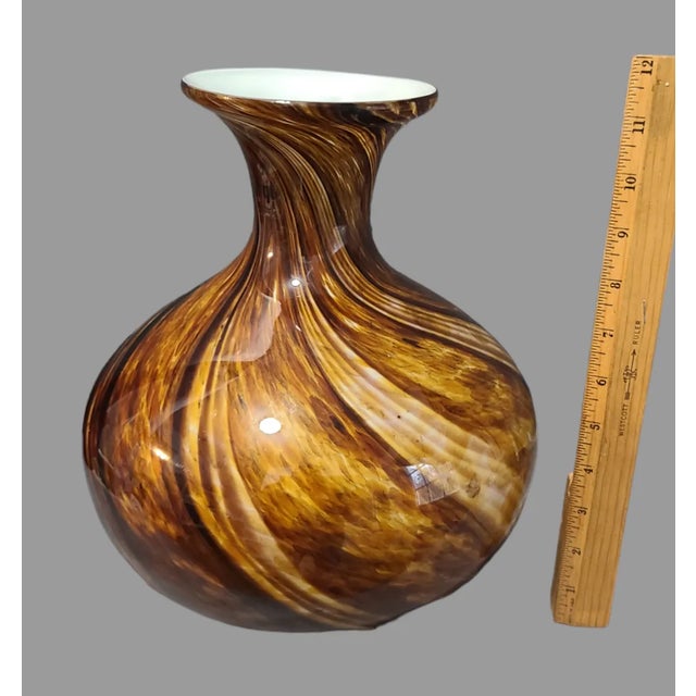 This unique and stunning Murano-style vase is a beautiful addition to any mid-century modern décor. The hand-blown glass...