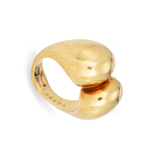 Scarce vintage Cartier sculptural ring crafted in 18k yellow gold (circa 1970s). The two bulbous gold domed terminals...
