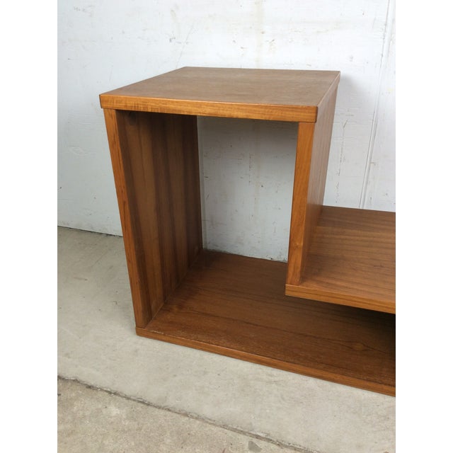 This Danish Modern Teak media storage shelf features pressed wood construction, teak veneer with original finish, unique...