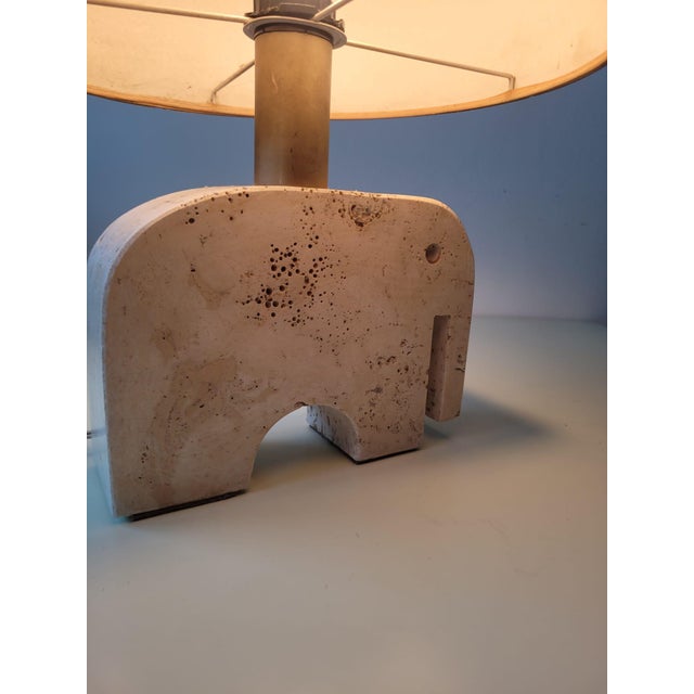 Vintage table lamp with an elephant-shaped travertine base, designed by Fratelli Mannelli. Made in Signa, Italy, 1970s....