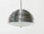 Nickel-plated pendant light composed of overlaid metal disks with frosted convex glass bottom. Chandelier has been...
